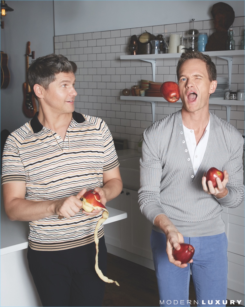 Juggling apples, David Burtka and Neil Patrick Harris take to the kitchen. Burtka wears a Prada polo and A.P.C. pants. Meanwhile, Harris dons Tom Ford henley shirts with Officine Generale pants.