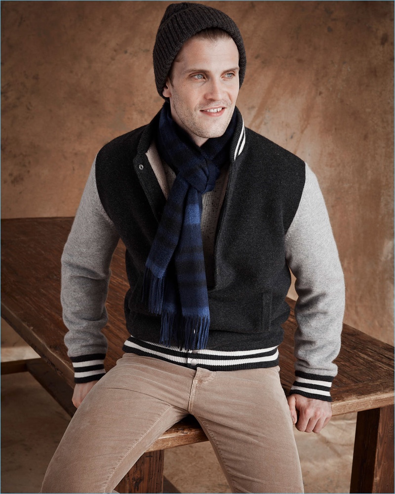 Embracing collegiate style, William Eustace rocks a Neiman Marcus cashmere baseball jacket.