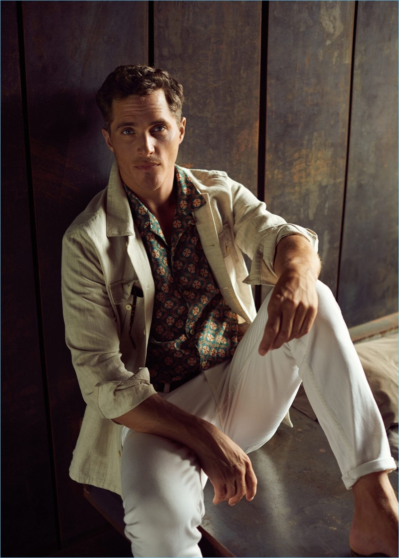 Ollie Edwards dons a linen-blend jacket and white jeans with a printed shirt by Mango Man.