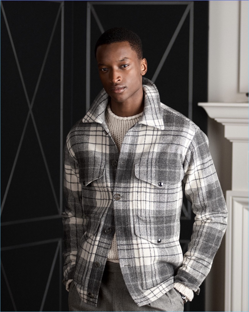 Oliver Kumbi dons a plaid wool tweed jacket from Ralph Lauren Purple Label.