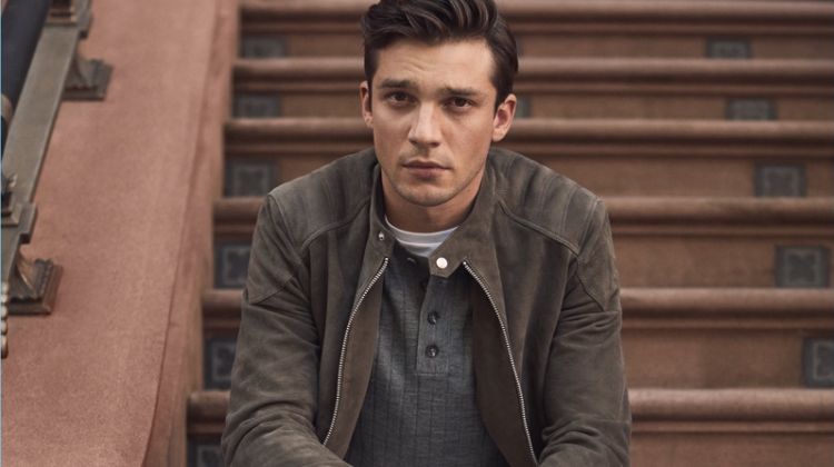A Shade of Suede: Alexis Petit wears a Reiss suede quilted jacket, ribbed henley, white jeans, and leather boots.