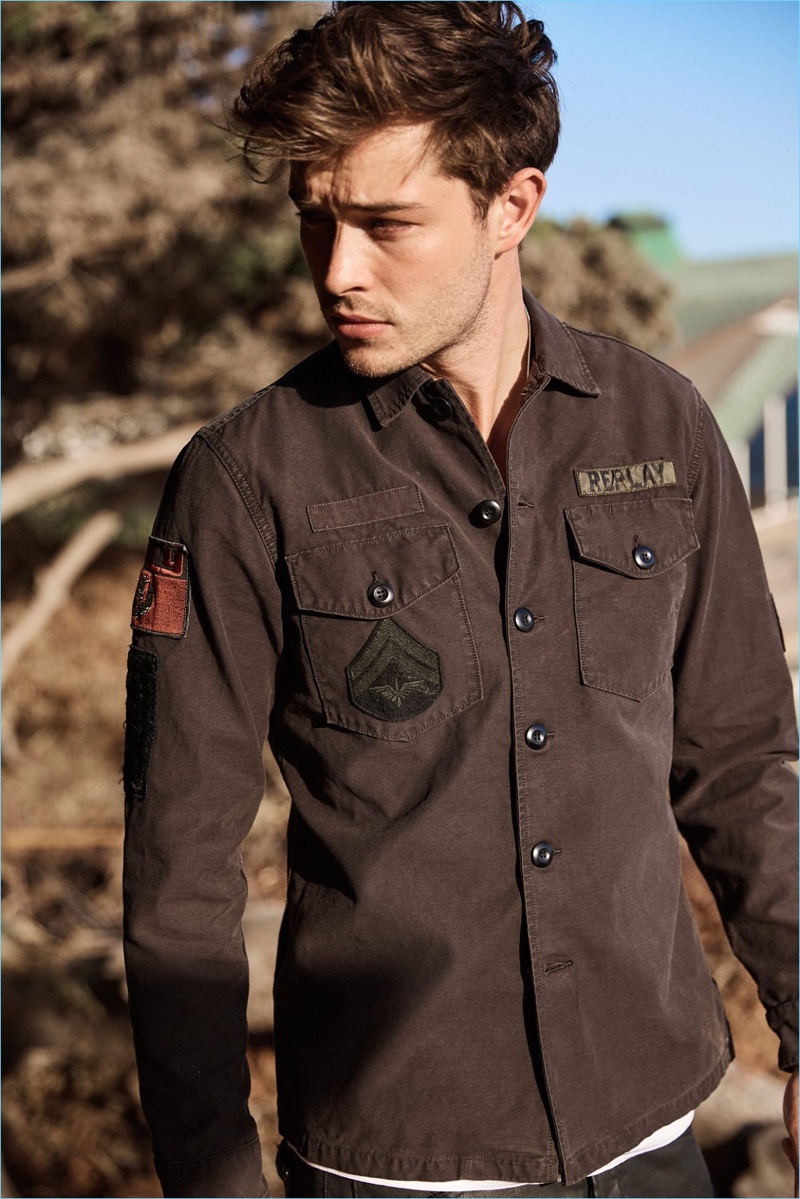 Model Francisco Lachowski sports a patched shirt from Replay.