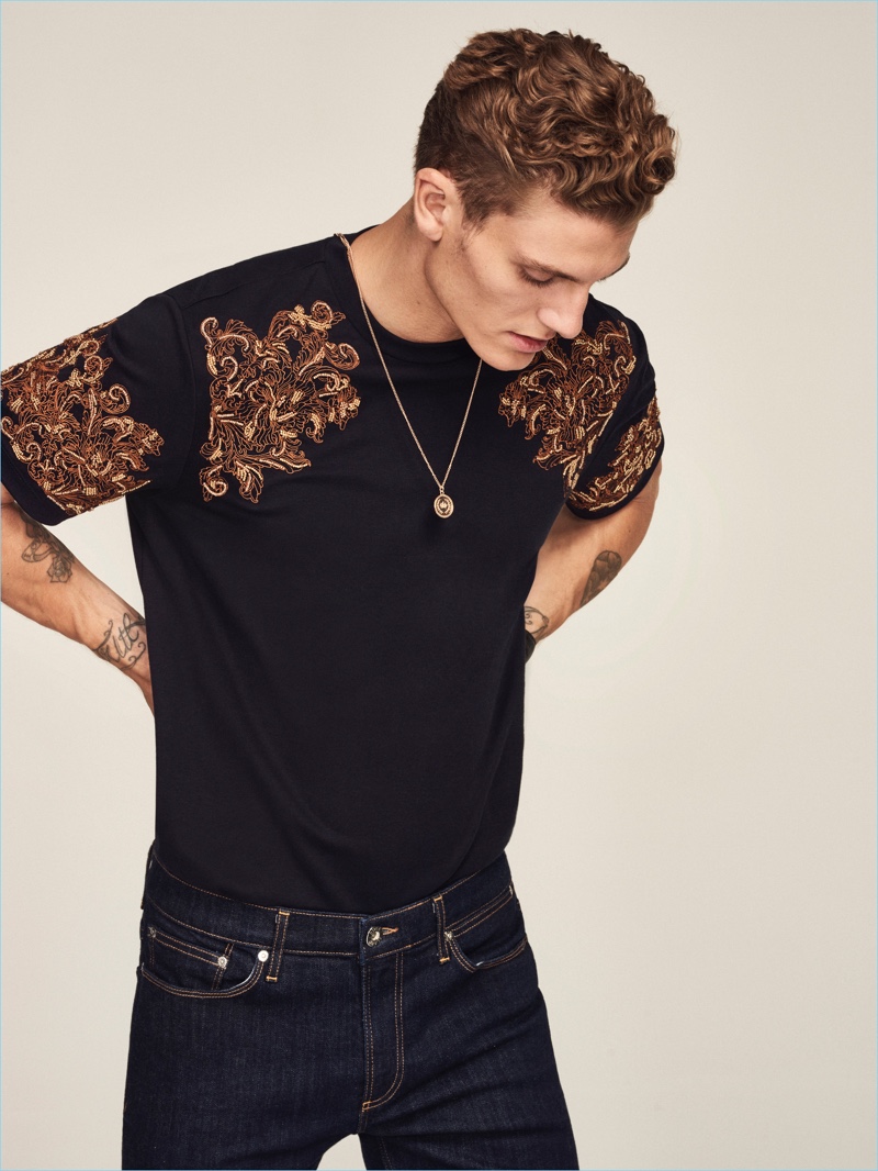 Making a casual statement, Mikkel Jensen sports a slim-fit embroidered t-shirt and jeans from River Island's RI30 collection.