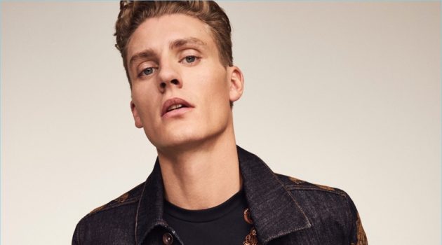 River Island Celebrates 30th Anniversary with New Capsule Front and center, Mikkel Jensen rocks an embroidered denim jacket and t-shirt with jeans from River Island's RI30 collection.