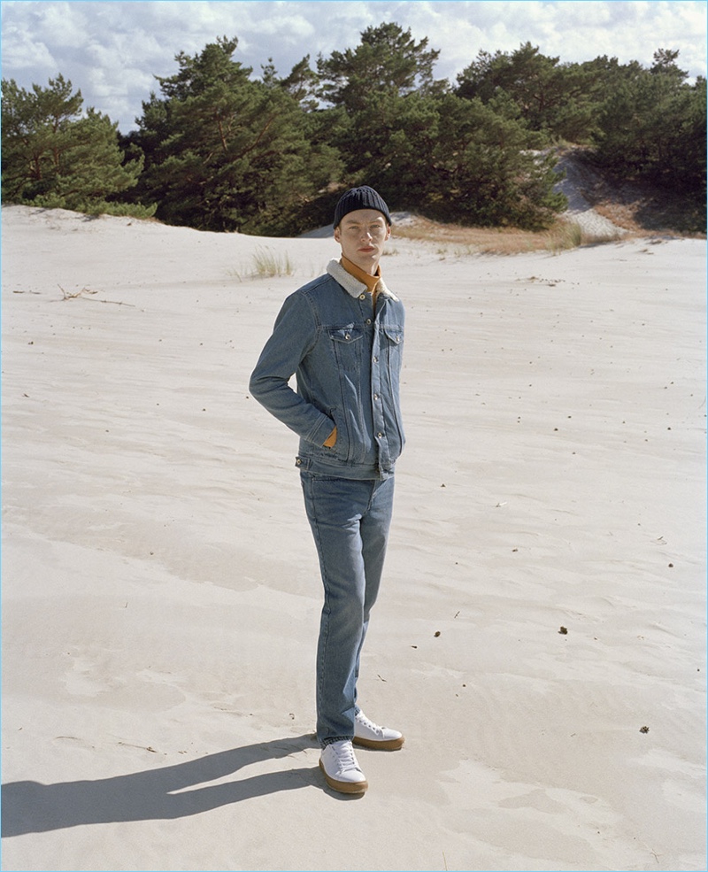 Taking to the beach, Roberto Sipos rocks a double denim look from Reserved.