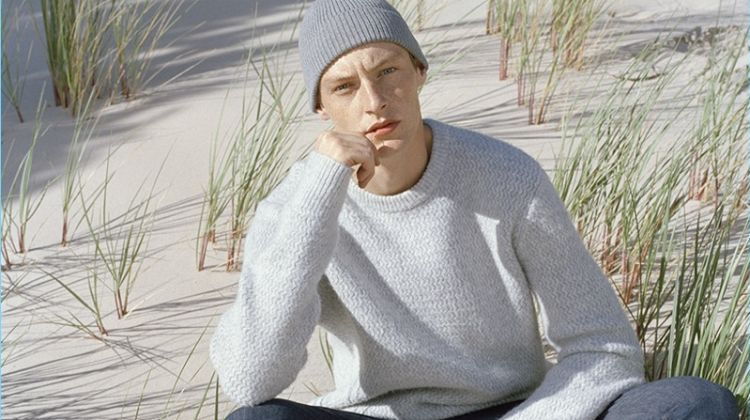 A smart vision, Roberto Sipos wears a sweater and slim-fit jeans.