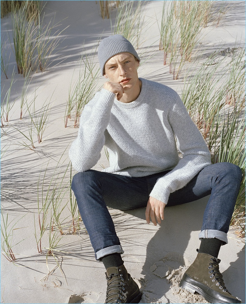 A smart vision, Roberto Sipos wears a sweater and slim-fit jeans.