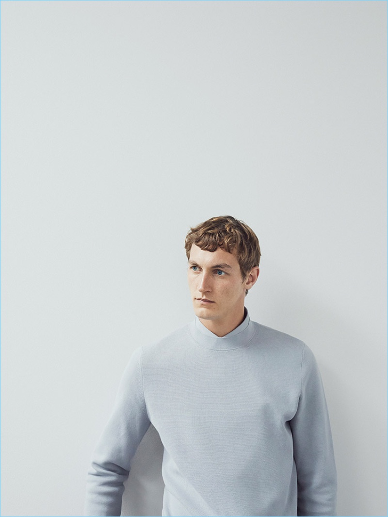 A smart vision, Rutger Schoone wears a COS mock-neck knitted sweater and cotton shirt.
