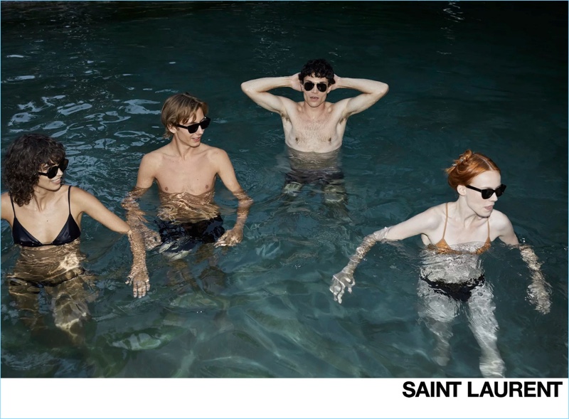 Models Mica ArgaÃ±araz, Paul Hameline, Luka Isaac, and Kiki Willems front Saint Laurent's spring-summer 2019 campaign.