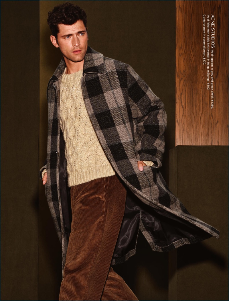 Dashing; to say the least, Sean O'Pry wears a plaid Acne Studios coat.