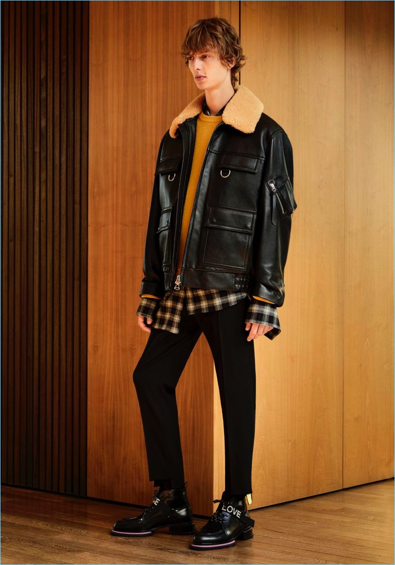 A cool vision, Leon Dame sports a leather jacket by Solid Homme.