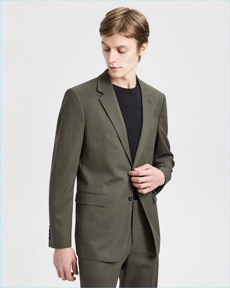 Model Janis Ancens dons Theory's Good Wool suit in military green.