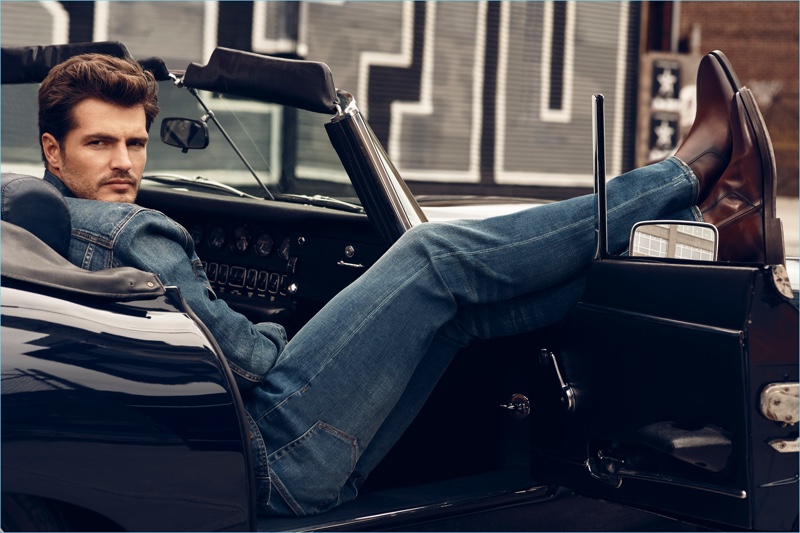 Relaxing in a convertible, Diego Miguel wears leather boots by To Boot New York.