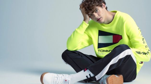 '90s Regatta: Darwin Gray in Tommy Jeans for Simons Front and center, Darwin Gray wears a look from Tommy Jeans.