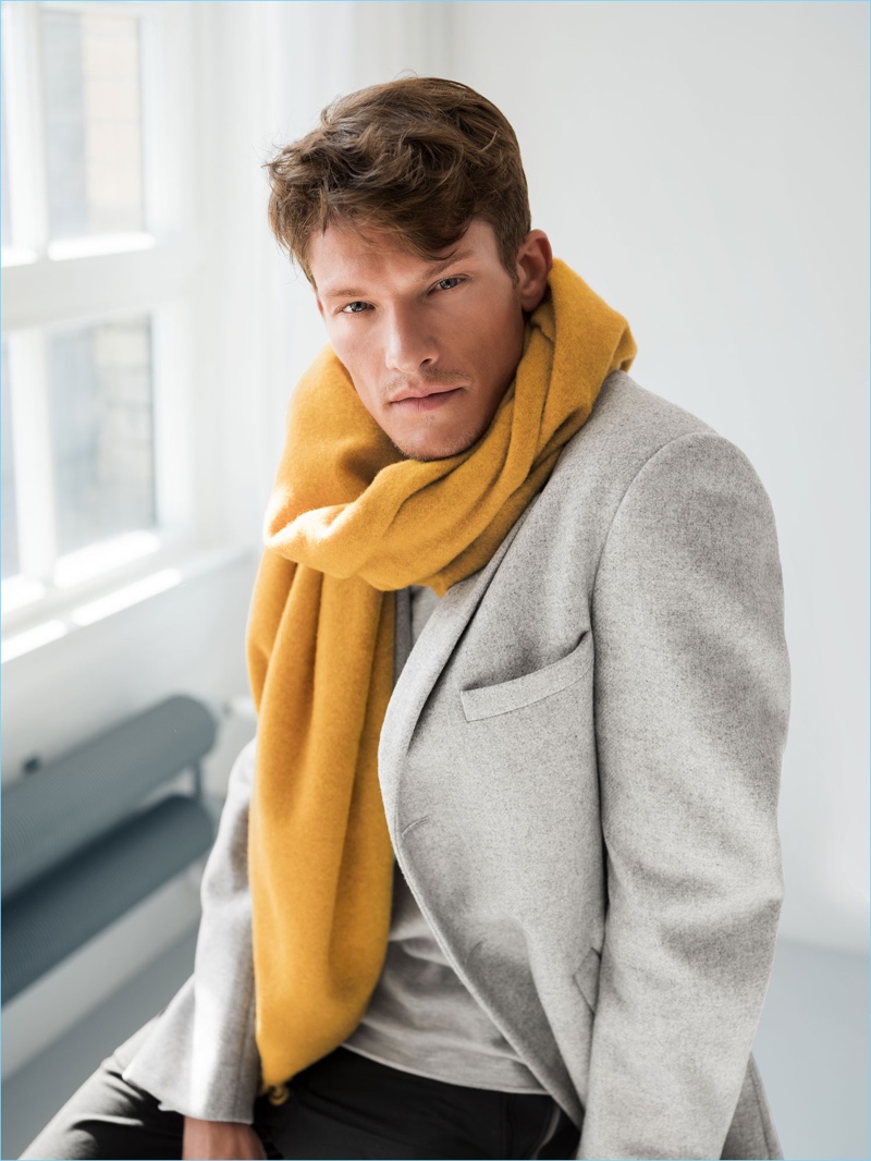 Sporting a yellow scarf and pale grey blazer, Danny Beauchamp appears in Wormland's fall-winter 2018 campaign.