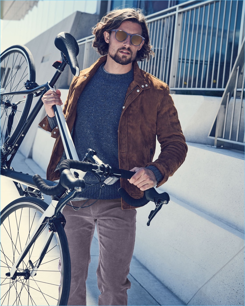 Wouter Peelen sports a Peter Millar crewneck sweater and corduroy pants with a brown suede jacket.