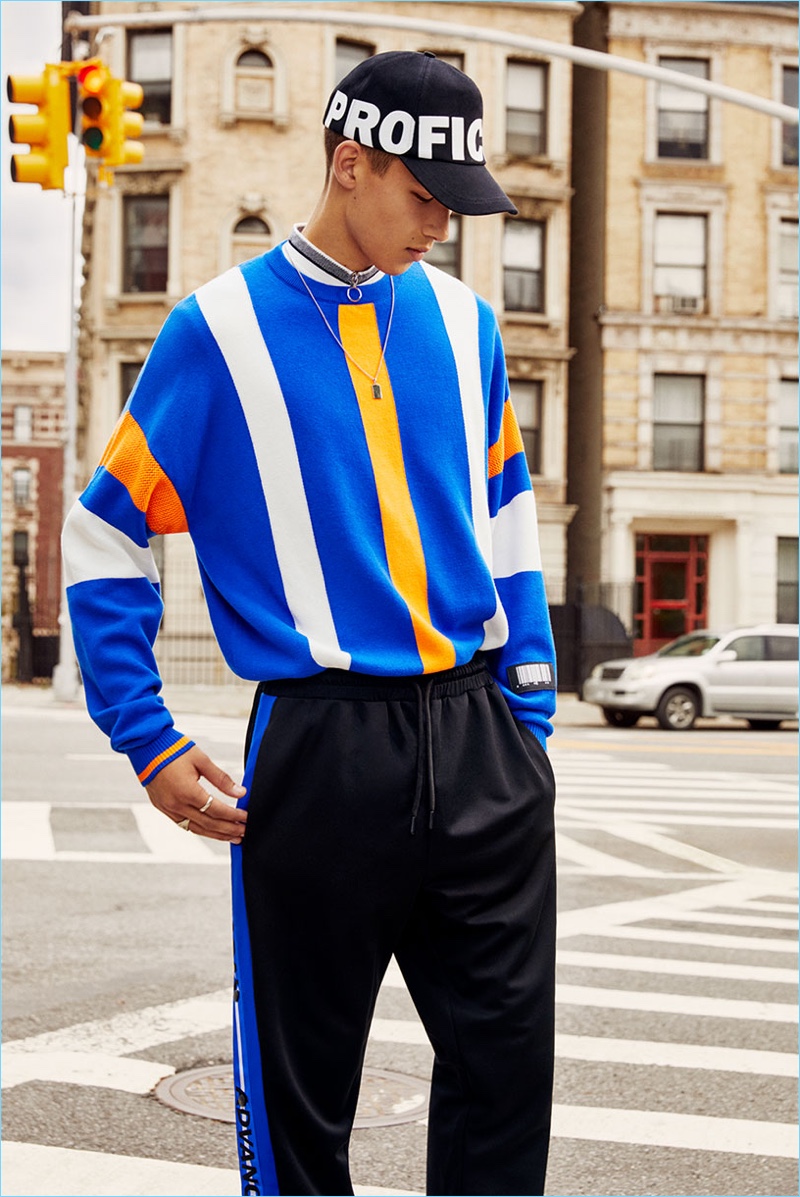 Tommy Vanden Meerssche sports a colorful striped pullover from Zara Man.