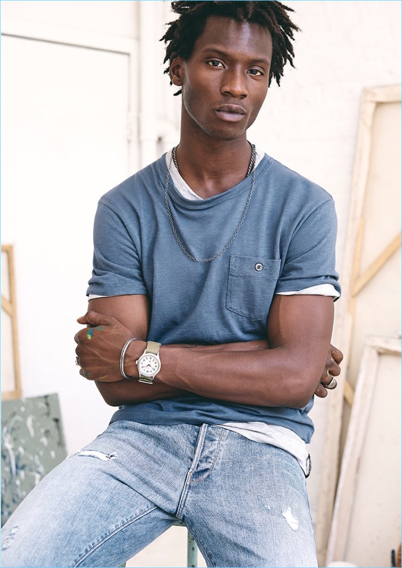 Tapping into laid-back style, Adonis Bosso wears a Todd Snyder pocket tee and Japanese stretch selvedge jeans.