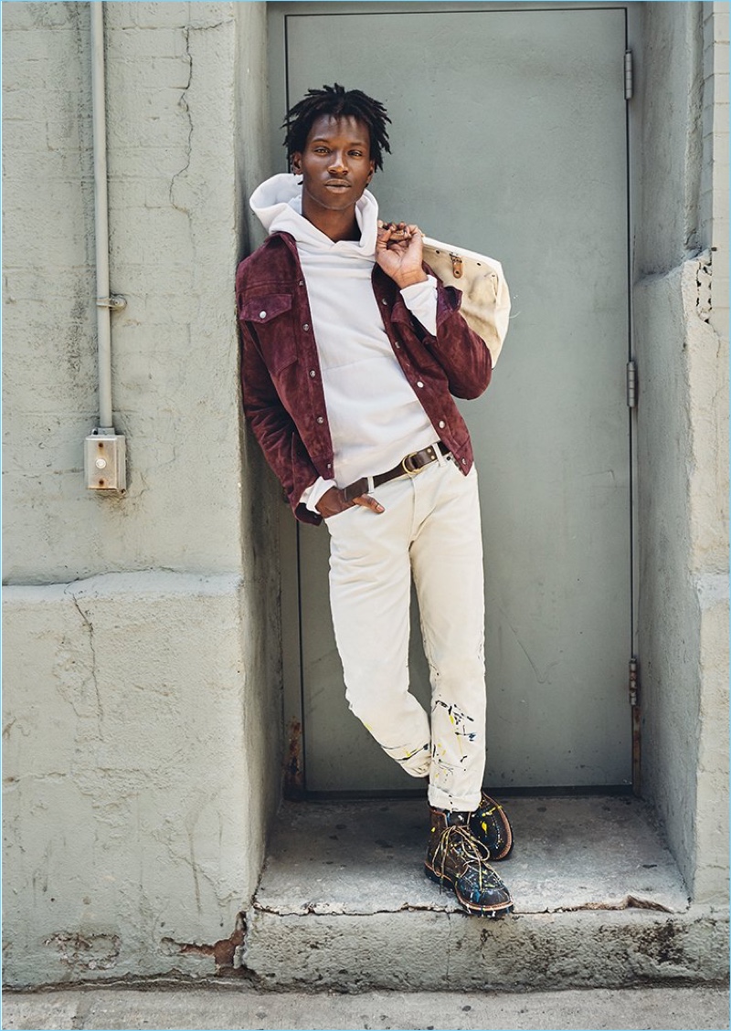 A chic vision, Adonis Bosso wears a Todd Snyder suede jacket and 5-pocket white pants with a Todd Snyder + Champion hoodie.