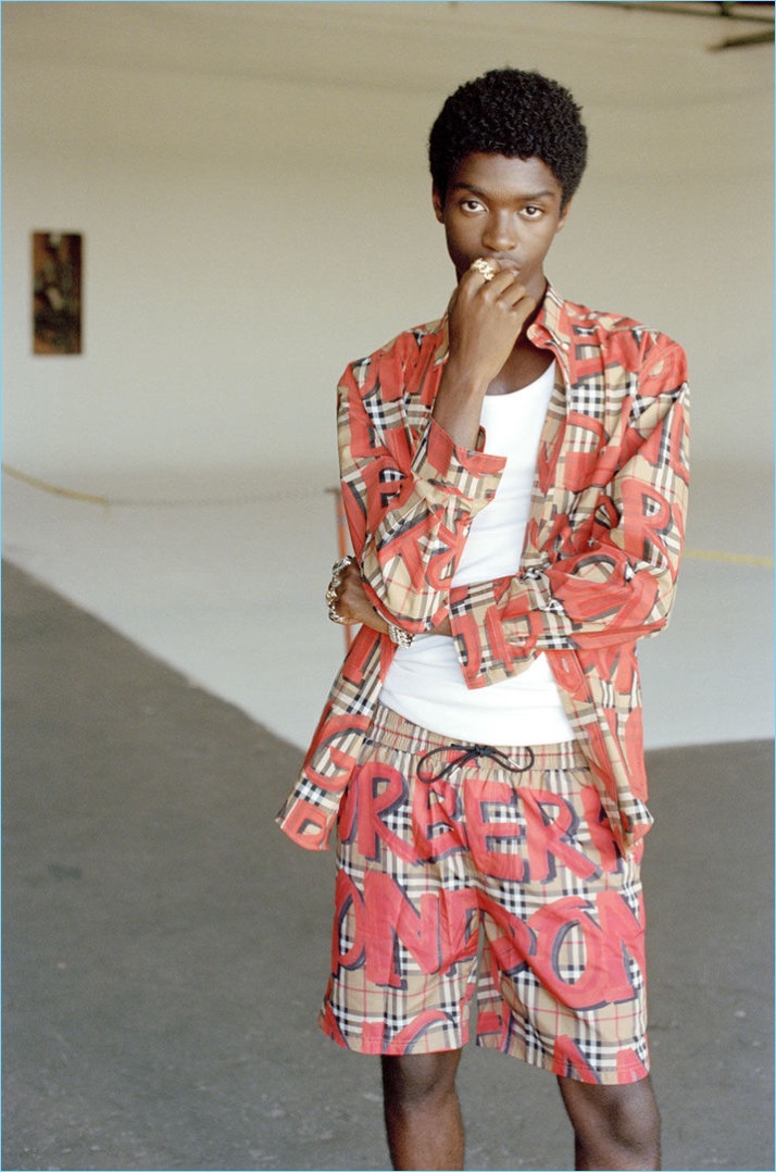 Making a case for prints, Alton Mason wears a Burberry shirt and shorts with Adidas by Raf Simons sneakers.