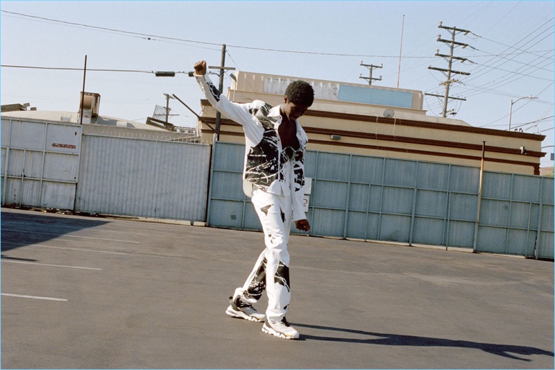 Connecting with Browns, Alton Mason steps out in a white and black look from Calvin Klein 205W39NYC.