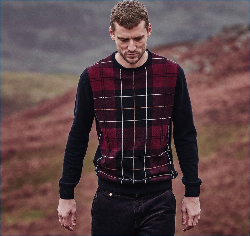 George Barnett dons a plaid sweater from Barbour's fall-winter 2018 tartan collection.