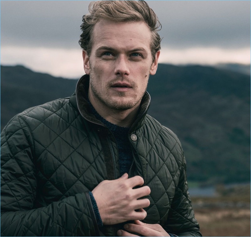 Outlander star Sam Heughan wears a quilted jacket from Barbour.