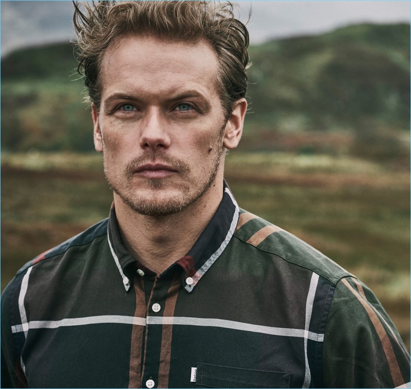 Actor Sam Heughan sports a plaid shirt from Barbour's fall-winter 2018 tartan collection.