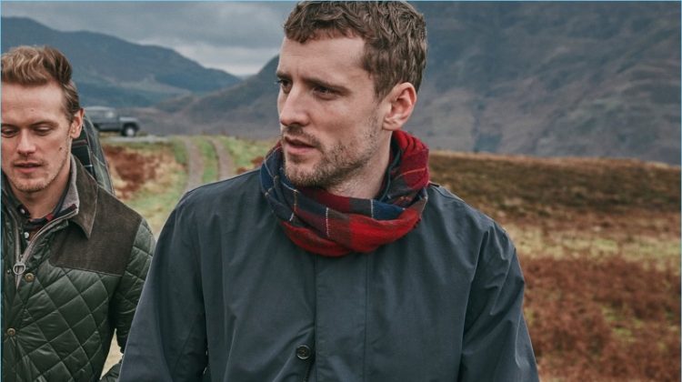 Sam Heughan and George Barnett wear pieces from Barbour's fall-winter 2018 tartan collection.