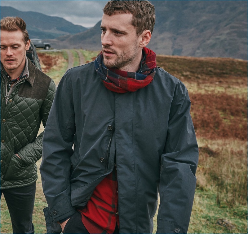 Sam Heughan and George Barnett wear pieces from Barbour's fall-winter 2018 tartan collection.