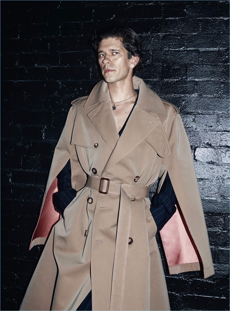 A chic vision, Ben Whishaw wears an Alexander McQueen double-breasted trench coat.