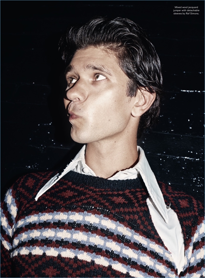 Making a silly face, Ben Whishaw wears a Raf Simons sweater.