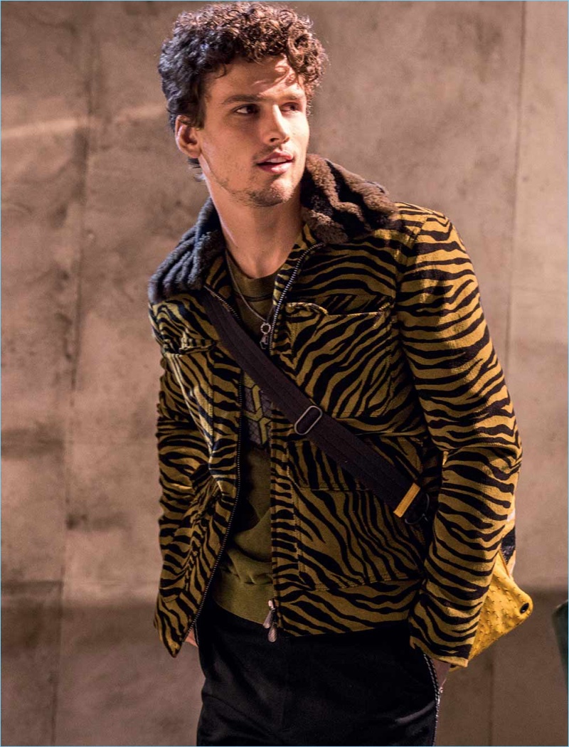 Simon Nessman sports a tiger print jacket from Bottega Veneta's fall-winter 2018 collection.