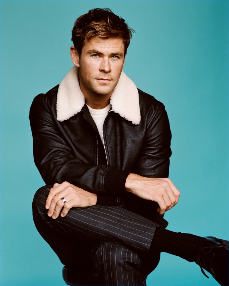 Sporting a Louis Vuitton leather bomber, Chris Hemsworth also wears a Saint Laurent sweater, Gucci pants, and Christian Louboutin shoes.