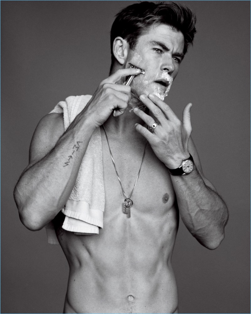 Going shirtless for the pages of GQ, Chris Hemsworth sports his own necklace and a TAG Heuer watch.