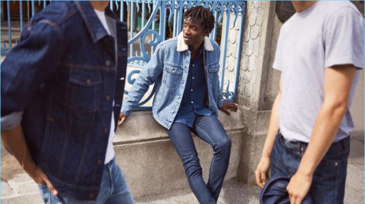 Models Ali Latif, Adonis Bosso, and Ben Allen sport denim essentials from H&M. Pictured center, Adonis dons a H&M pile-lined denim jacket, plaid oxford shirt, skinny jeans, and leather monkstrap shoes.