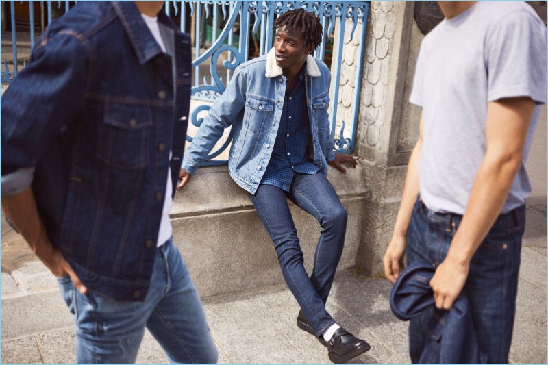 Models Ali Latif, Adonis Bosso, and Ben Allen sport denim essentials from H&M. Pictured center, Adonis dons a H&M pile-lined denim jacket, plaid oxford shirt, skinny jeans, and leather monkstrap shoes.