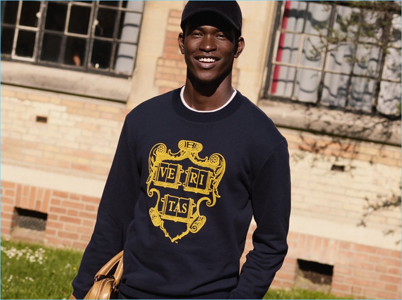 All smiles, Salomon Diaz wears a pullover from H&M Studio's fall-winter 2018 men's collection.