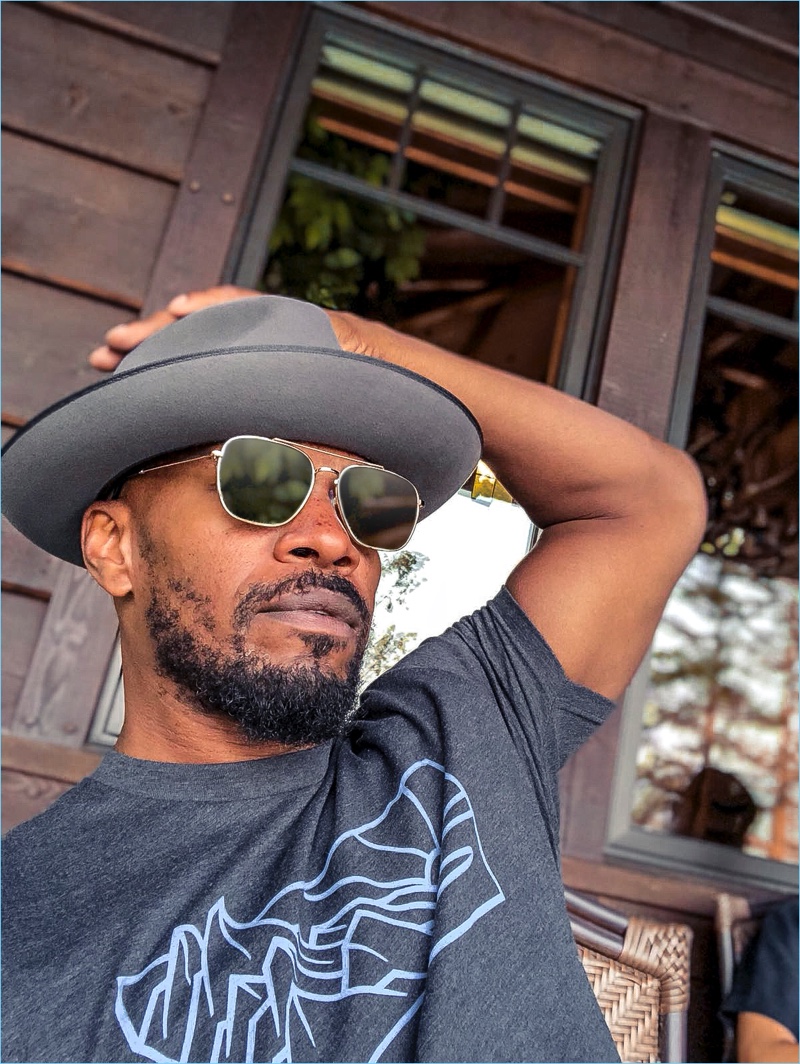 Relaxing, Jamie Foxx wears The Patriot sunglasses by Privé Revaux.