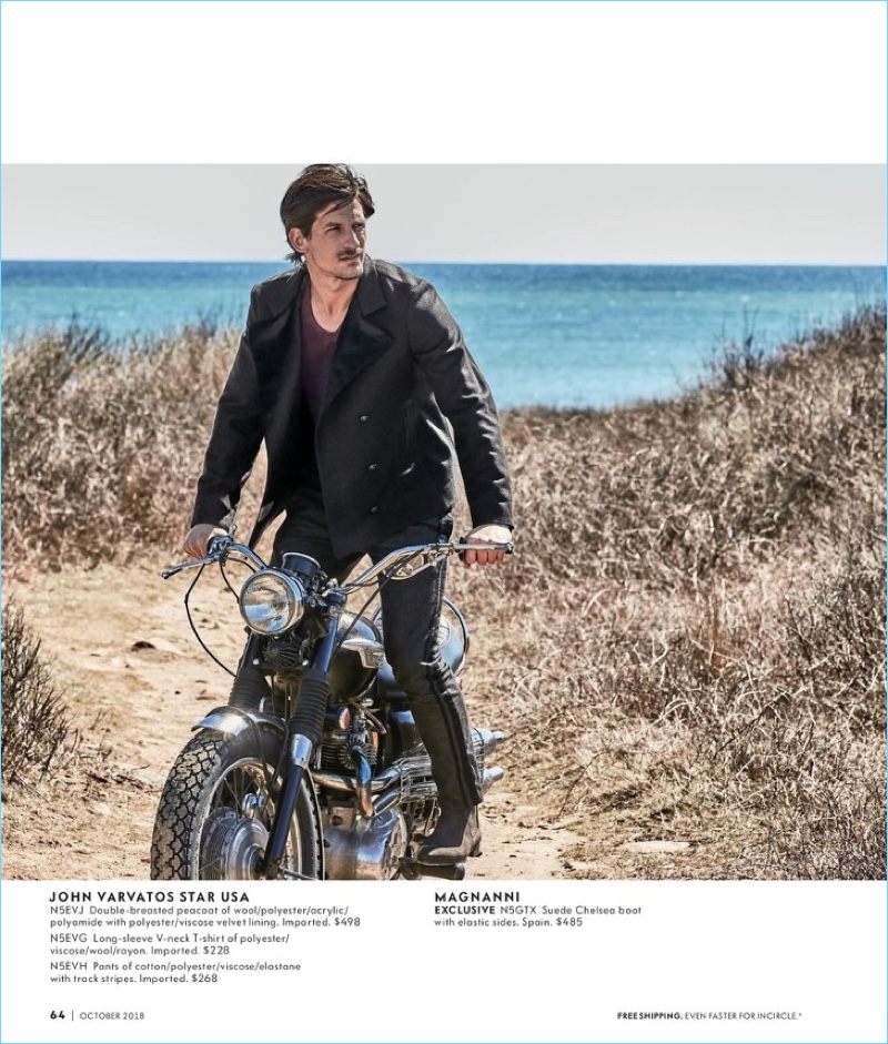 Riding a bike, Jarrod Scott wears a look from John Varvatos Star USA. He also rocks Magnanni Chelsea boots.