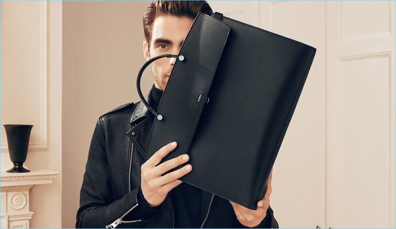 Spanish model Jon Kortajarena poses with Furla's Mercurio bag for its fall 2018 campaign.