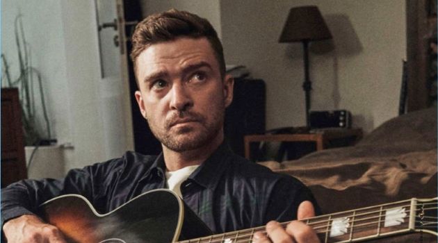 Singer Justin Timberlake sports a Burberry shirt, Kelly Cole t-shirt, and Levi's jeans.