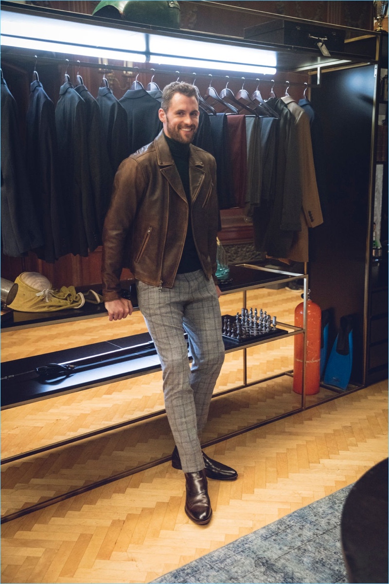 A chic but trendy vision, Kevin Love sports a brown leather biker jacket with a turtleneck sweater and windowpane print pants from his Banana Republic collaboration.