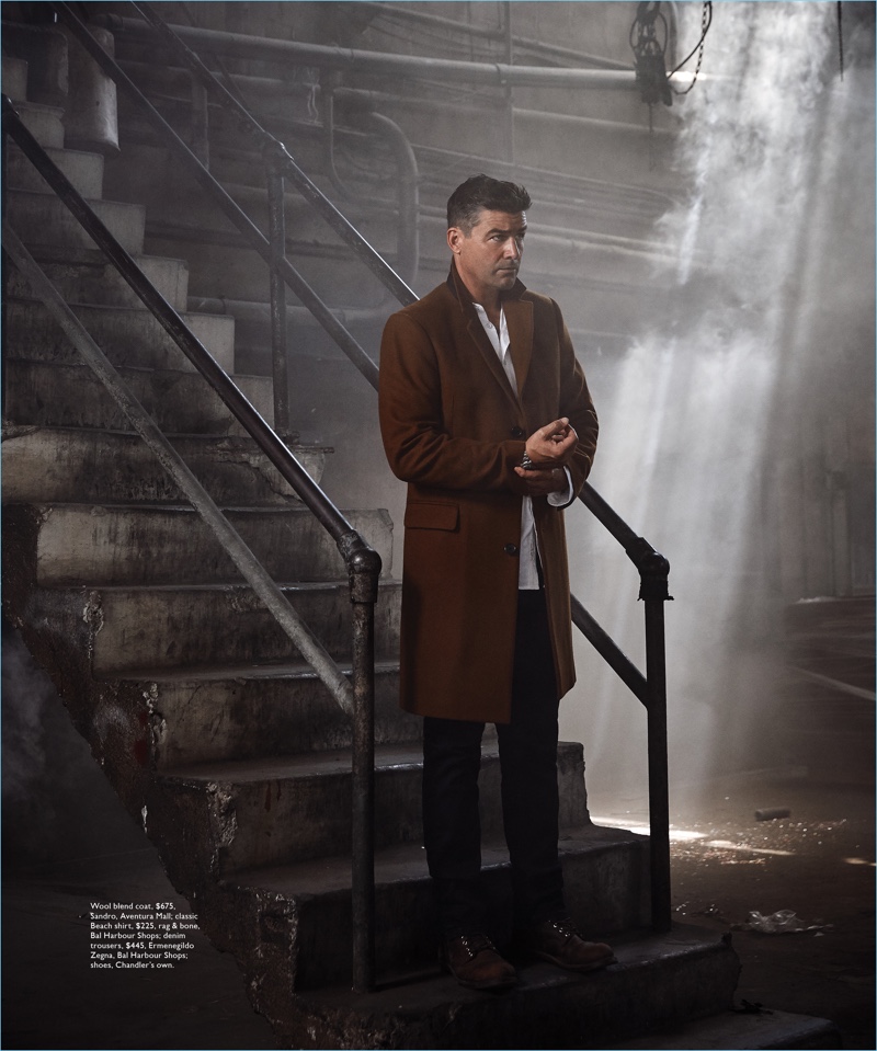 Wearing a Sandro coat, Kyle Chandler dons a Rag & Bone shirt and Ermenegildo Zegna trousers as well.