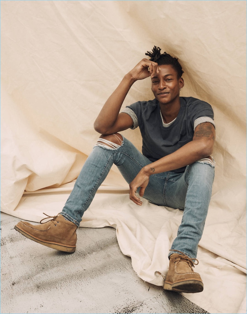 A relaxed vision, Ty Ogunkoya layers with a Madewell crewneck tee, and triblend tee. He also sports the brand's ripped denim jeans.