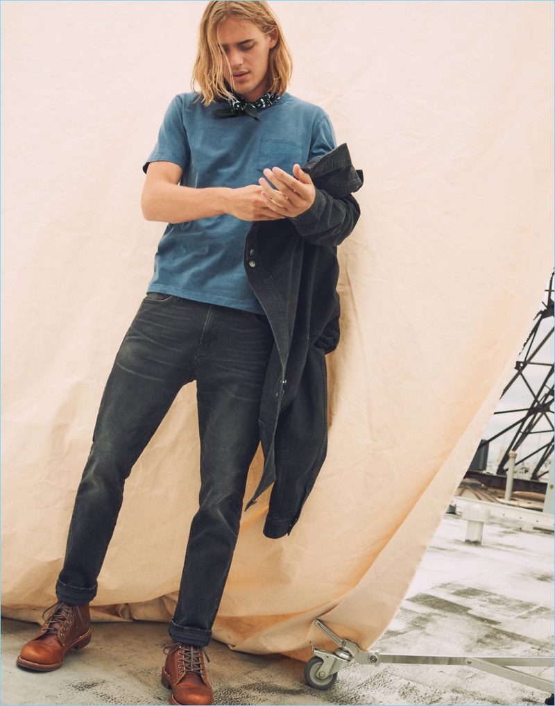 Model Ton Heukels dons Madewell's pocket tee, denim jean jacket, and slim-fit jeans.