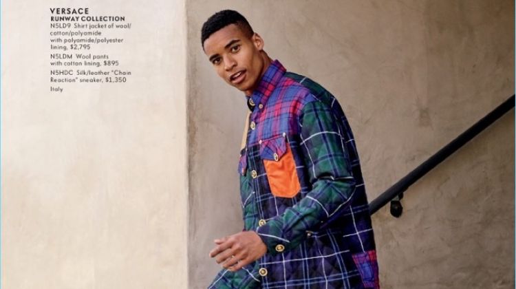 Embracing tartan, Malik Lindo wears a look from Versace.