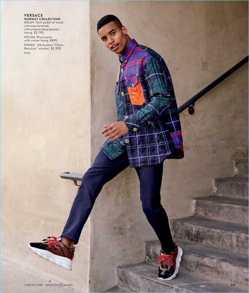 Embracing tartan, Malik Lindo wears a look from Versace.