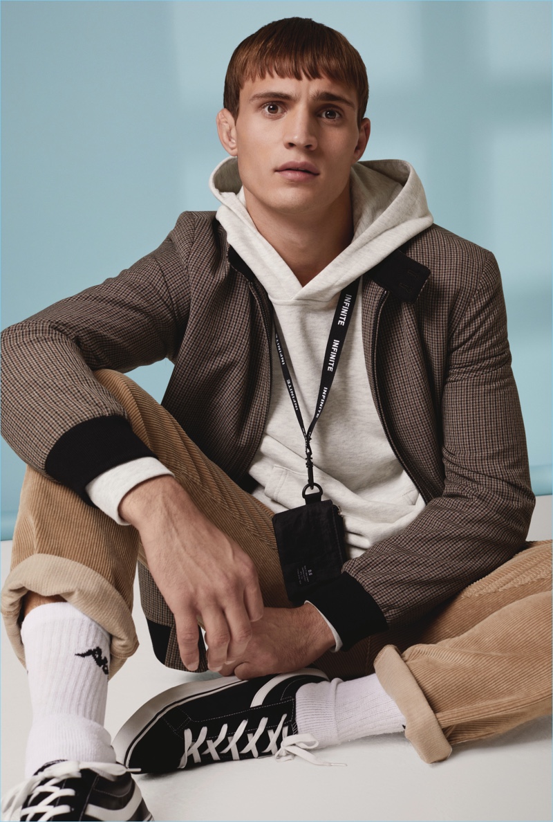 Front and center, Julian Schneyder wears fall essentials such as corduroy pants for Primark.