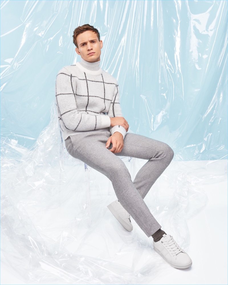 Embracing pale shades of grey, Julian Schneyder wears a look from River Island's Christmas collection.